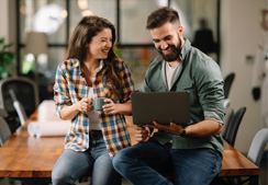 Woman and man on a laptop 